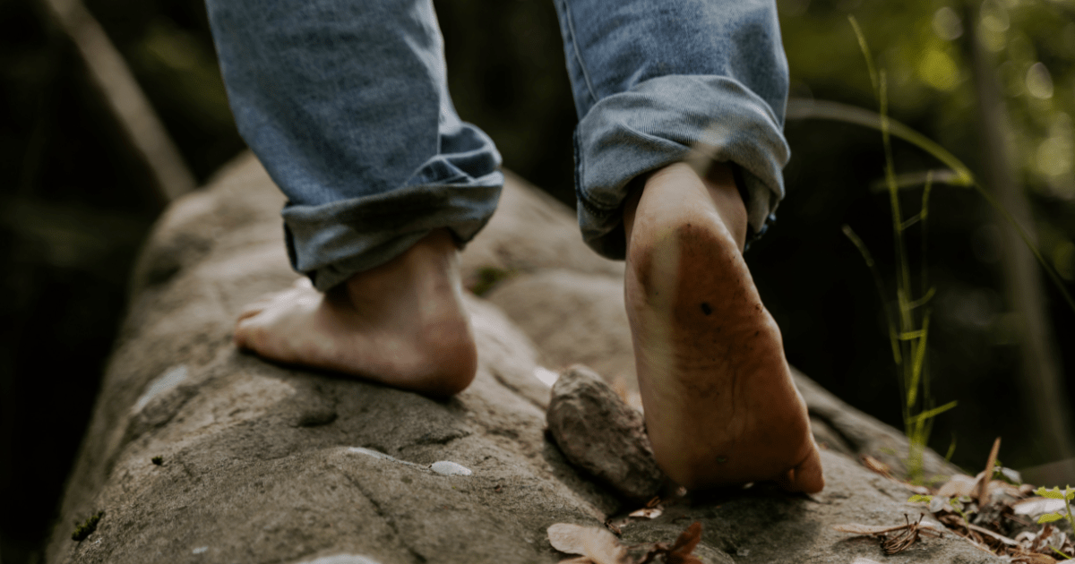 Barefoot on tree bark