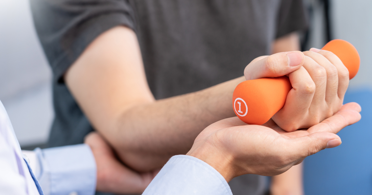 Physiotherapy with dumbbells