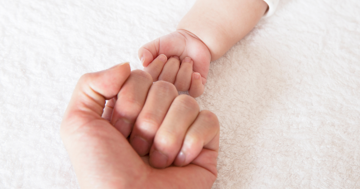 Fist Bump Between Parent and Baby